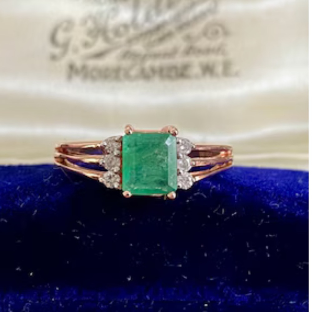 Elegant 10k rose gold emerald and diamond ring